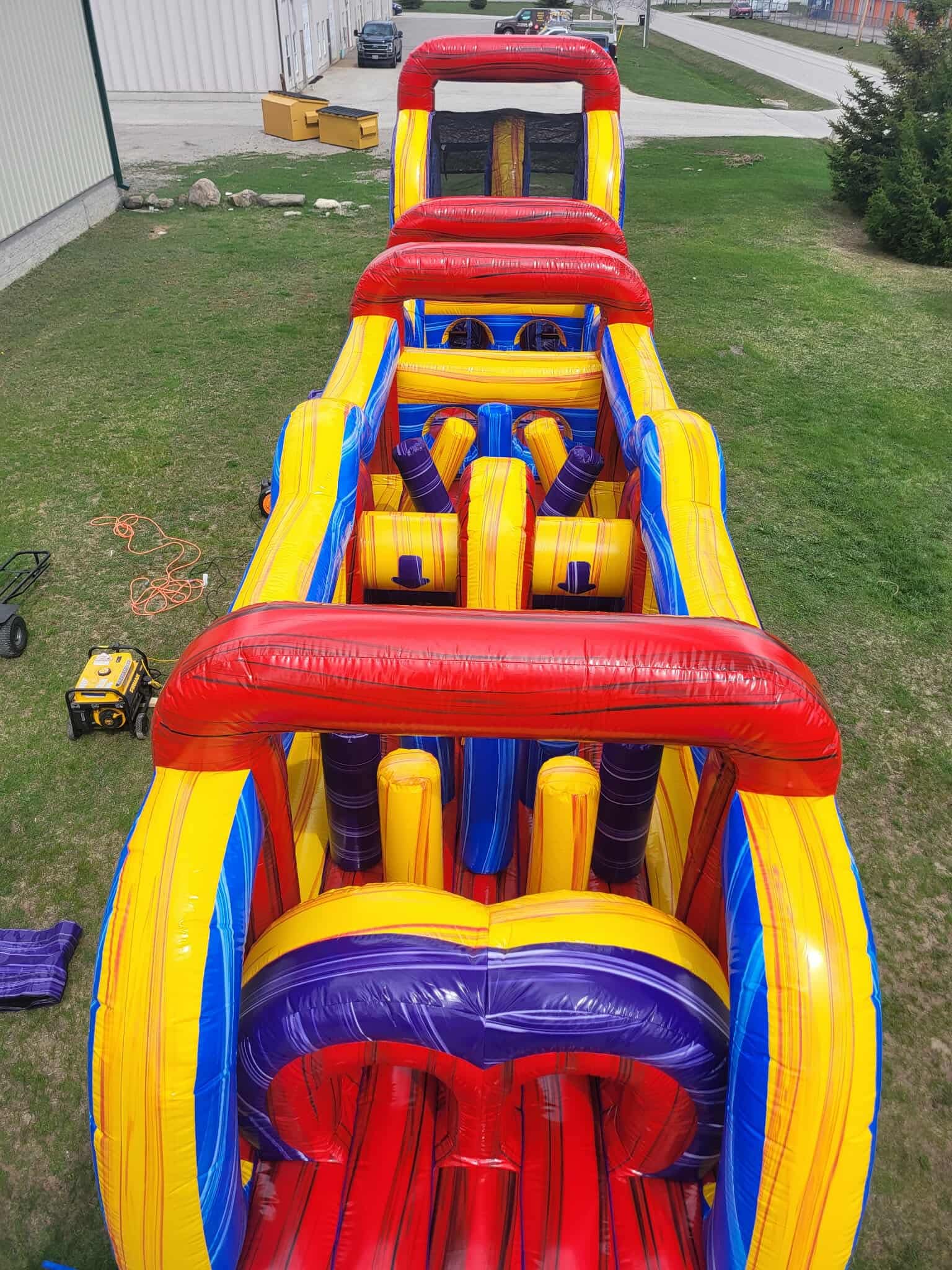 Large inflatable obstacle course set up for a professional community event in Simcoe County.