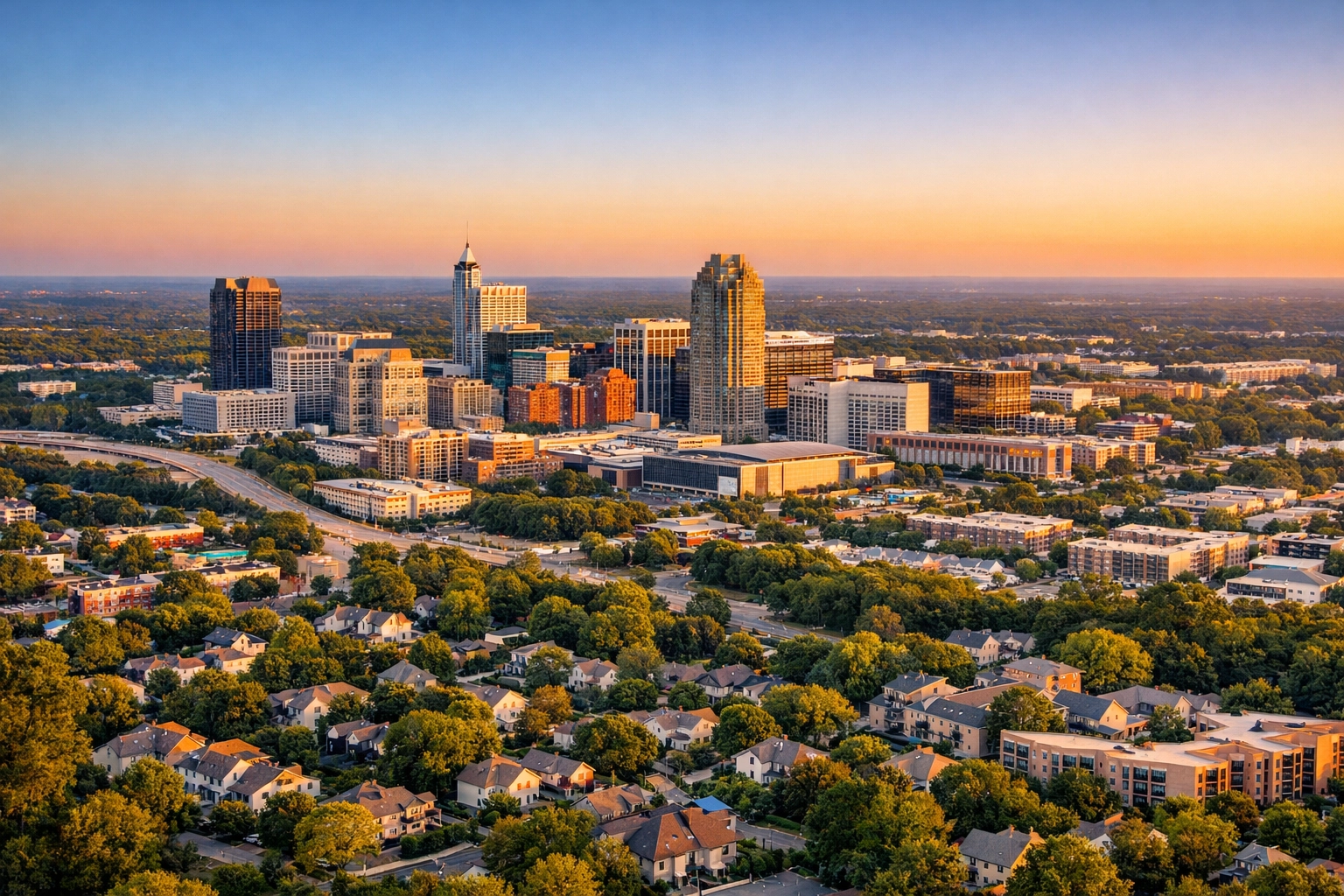 Aerial view of Raleigh-Durham NC Triangle skyline showing residential neighborhoods and downtown