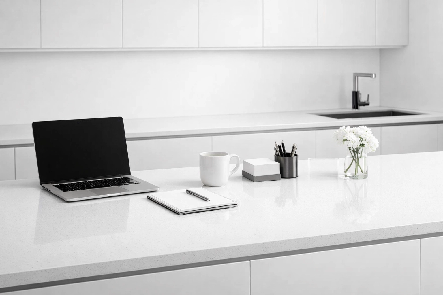 Neutral 4000K LED task lighting on a modern white quartz countertop and minimalist kitchen cabinetry.