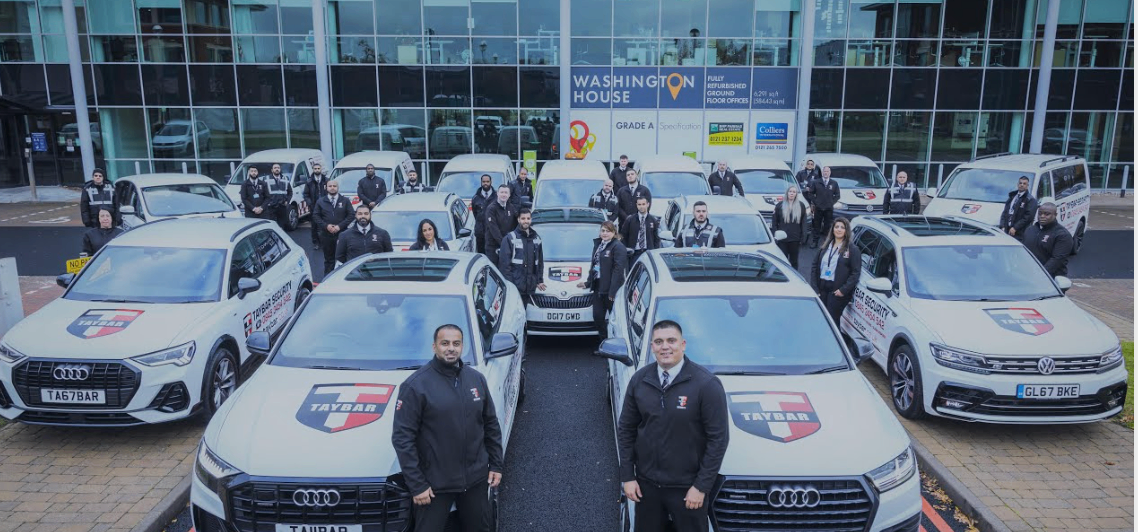 Security Team With Vehicles at Office Building