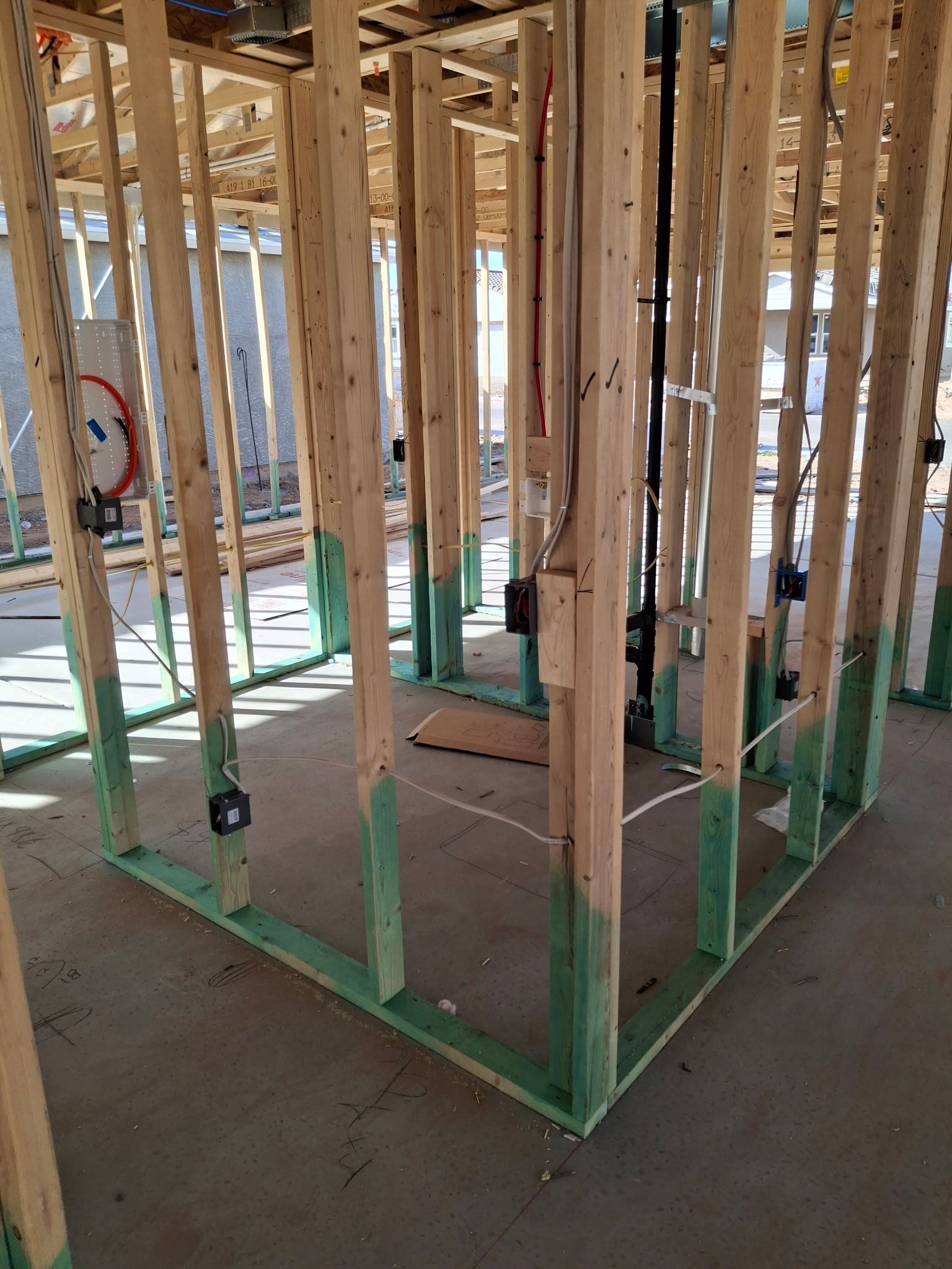 Wood framing of a new home showing termite prevention treatment