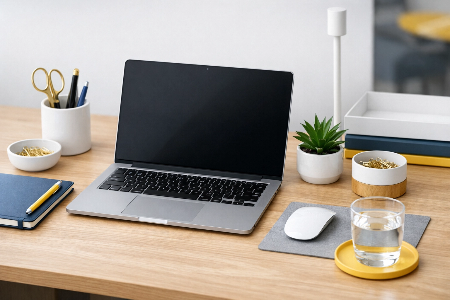 Spotless, minimalist office desk with subtle blue, white, and yellow accents.