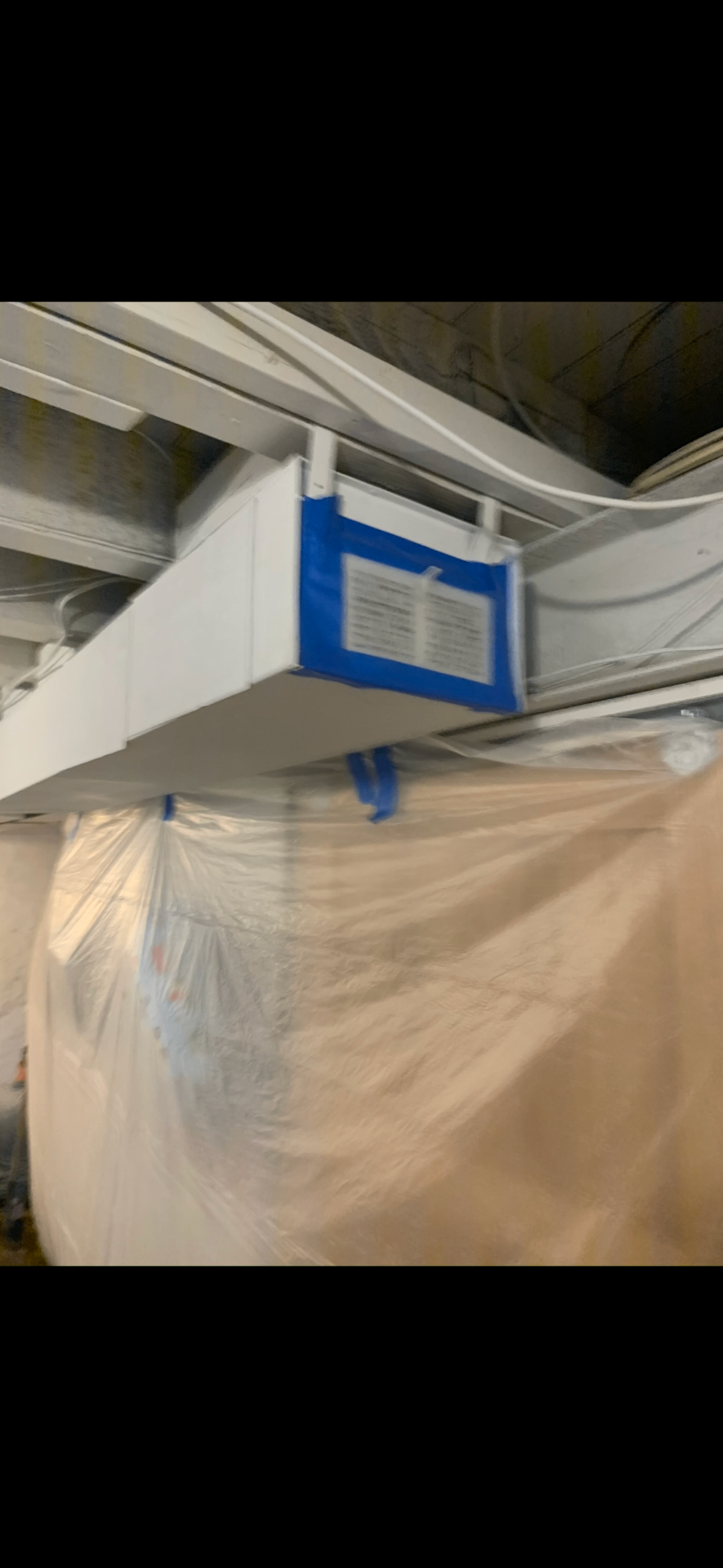 Plastic Sheeting and Blue Painter's Tape Work Area