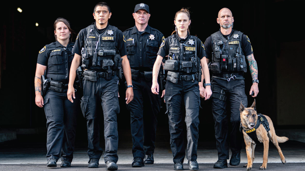 Diverse Law Enforcement Team Walking Forward