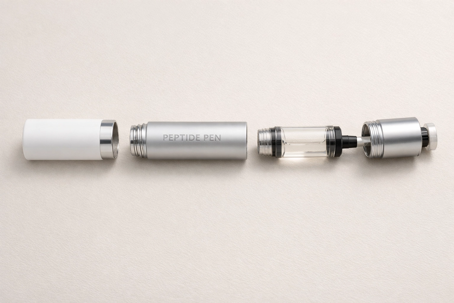 View of a disassembled peptide pen revealing the glass cartridge housing and screw threads.