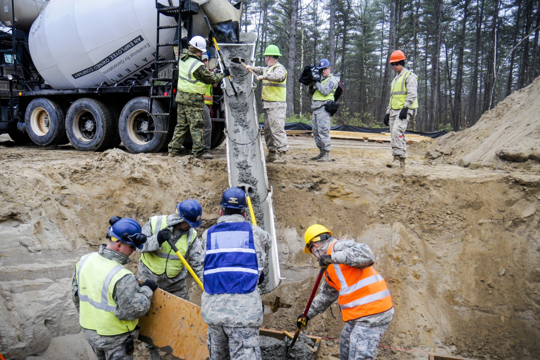 Construction Crew Pouring Concrete