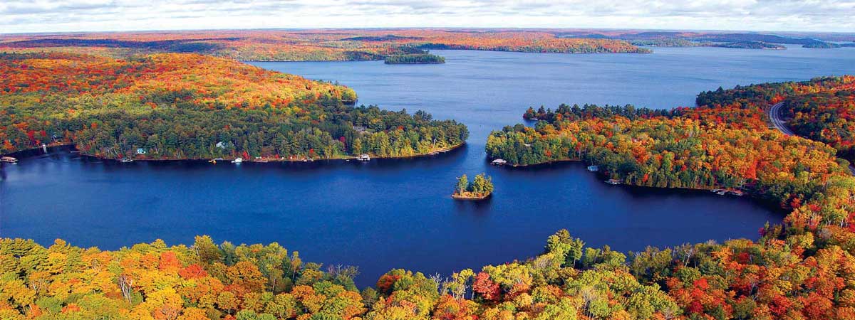 Aerial view of Muskoka lakefront properties in autumn