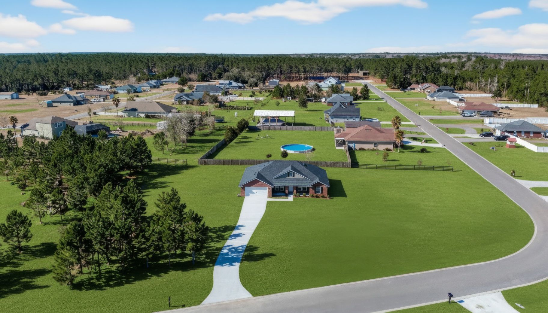 After grass enhancement at 55225 Bartram Trail showing lush green lawn