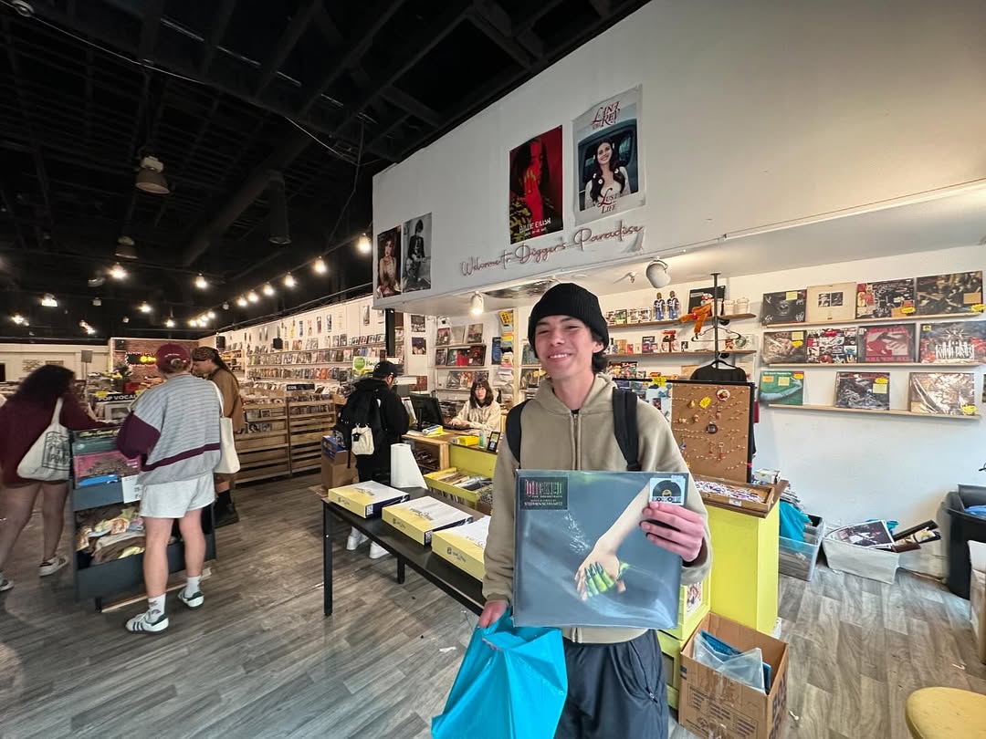Customers browsing and buying vinyl records at Nivessa