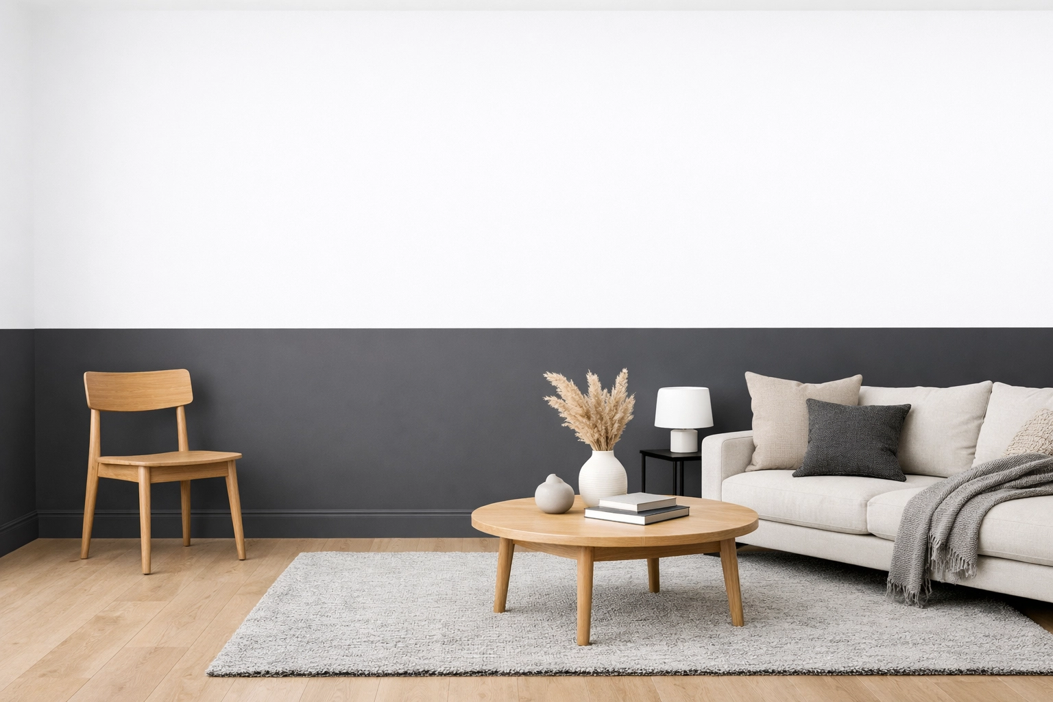 Charcoal and white two-tone wall in a modern living room showing a crisp professional paint finish.
