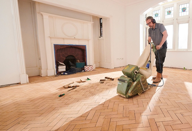 Flooring Specialist Refinishing Herringbone Hardwood Floor