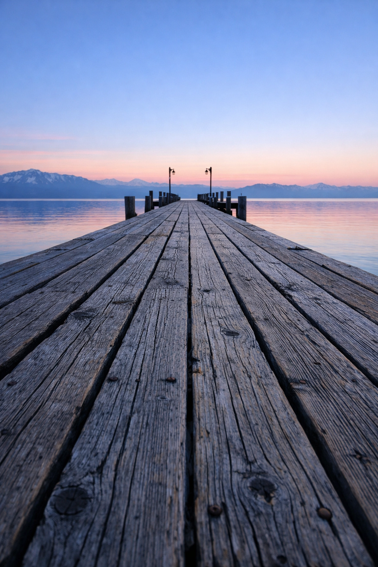 Wooden leading lines of Valhalla Pier at Lake Tahoe during a colorful sunrise for fine art shots.