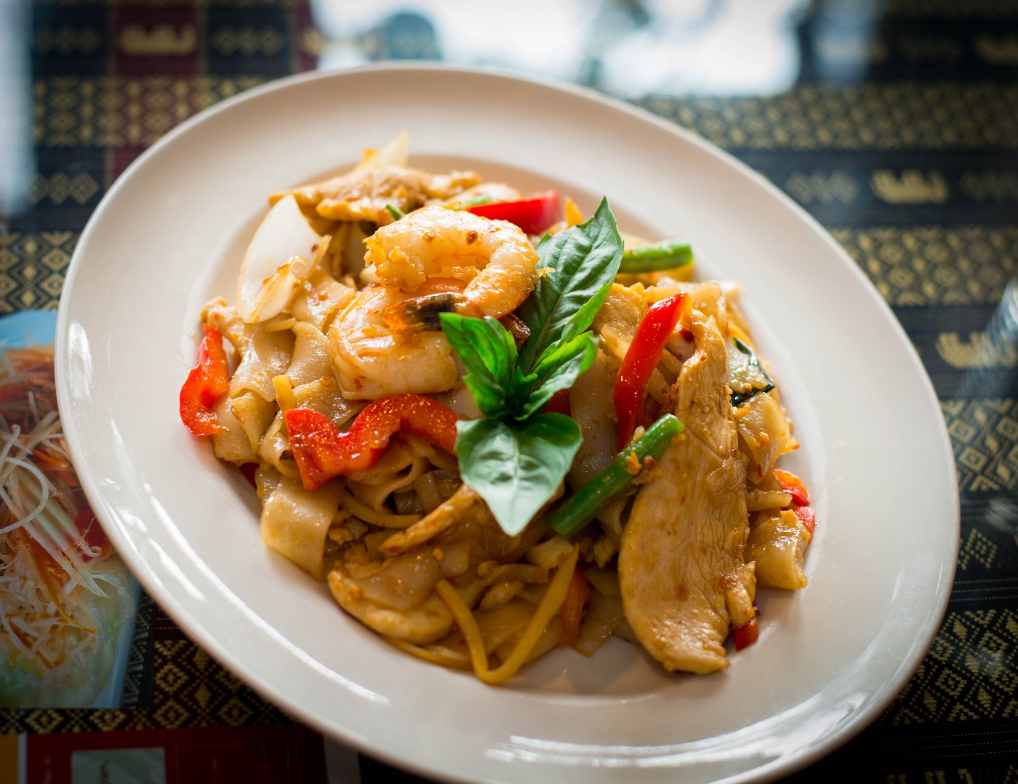 Noodle Kee Mao—wok-tossed noodles with basil fragrance and chili warmth (authentic photo)