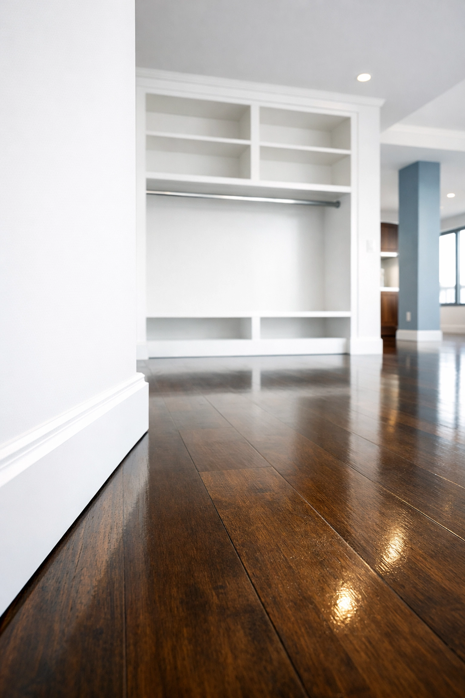 Immaculate hardwood floors and clean white baseboards in a Seaport loft after a Boston apartment move-out.