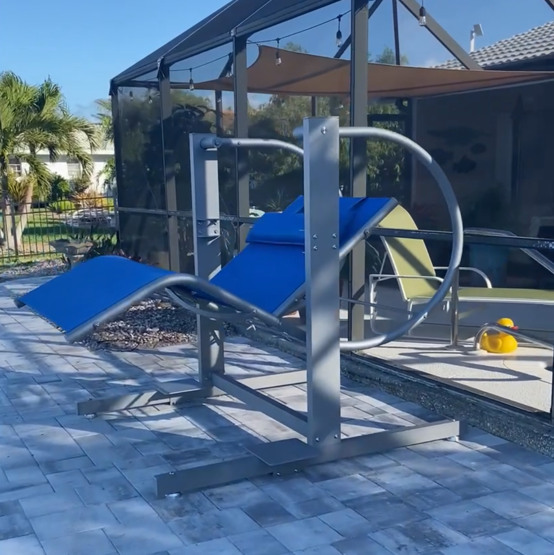 Zero Gravity Swing Double Lounge by David Frank Furniture featuring plush blue cushions and a sleek, powder-coated steel frame.