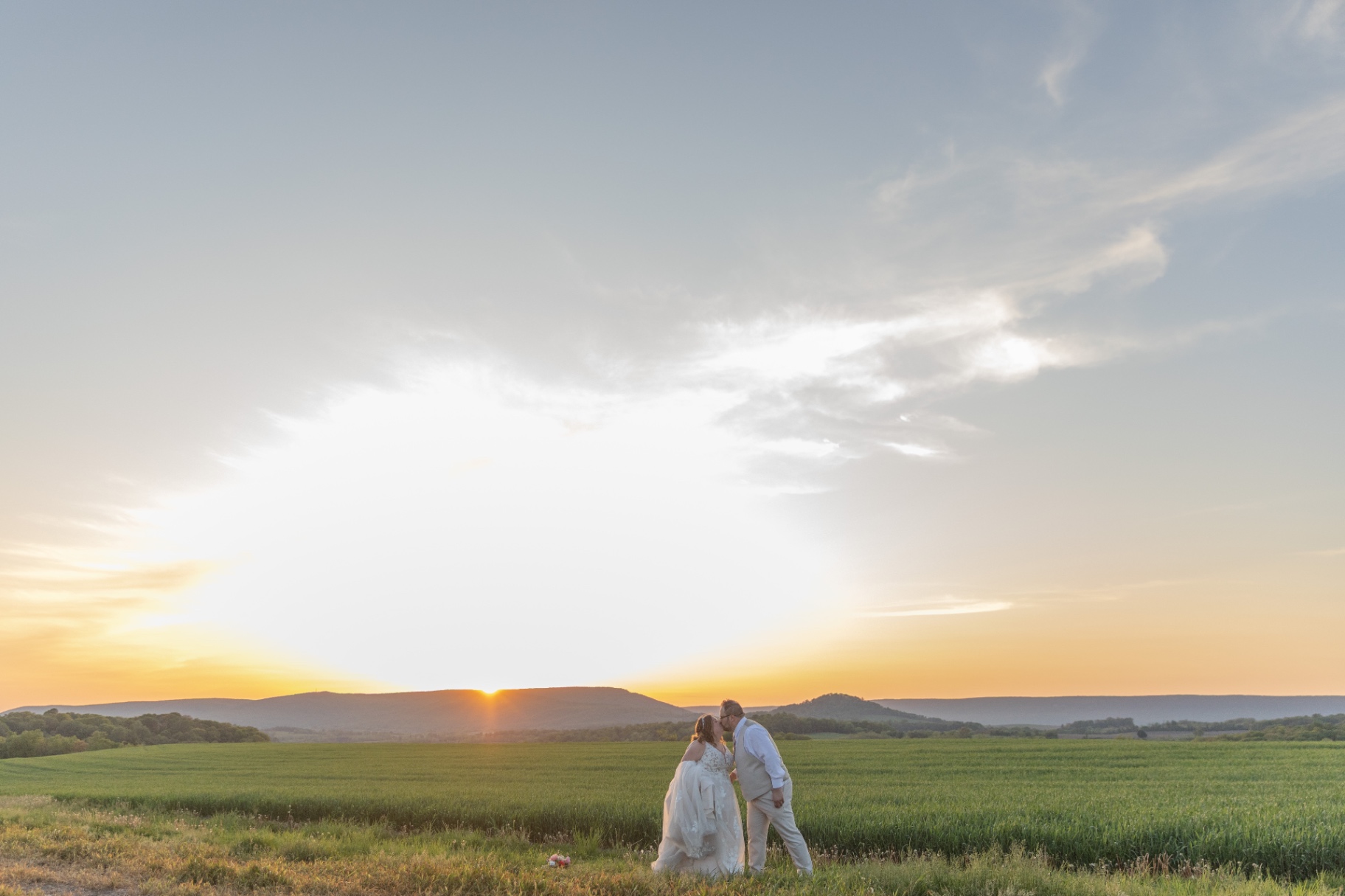 A tender reception moment—laughter, movement, and that end-of-night kind of joy