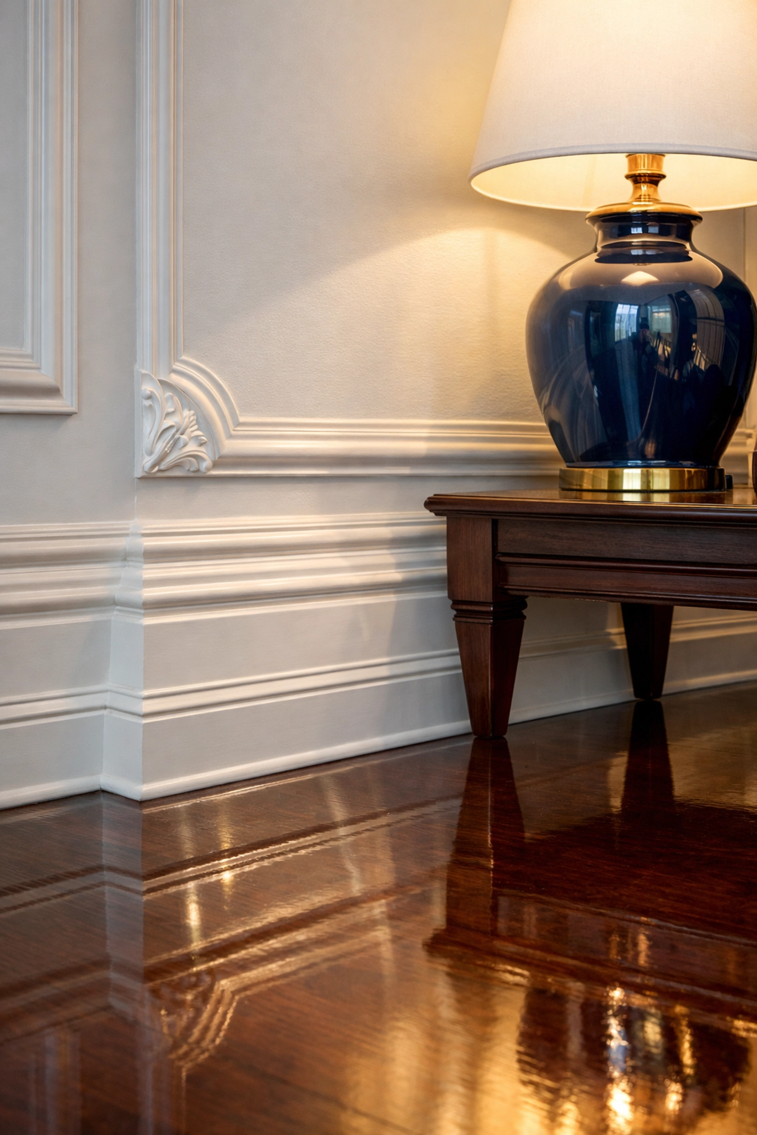 Detail-oriented residential cleaning Massachusetts on polished mahogany floors and white wainscoted walls.