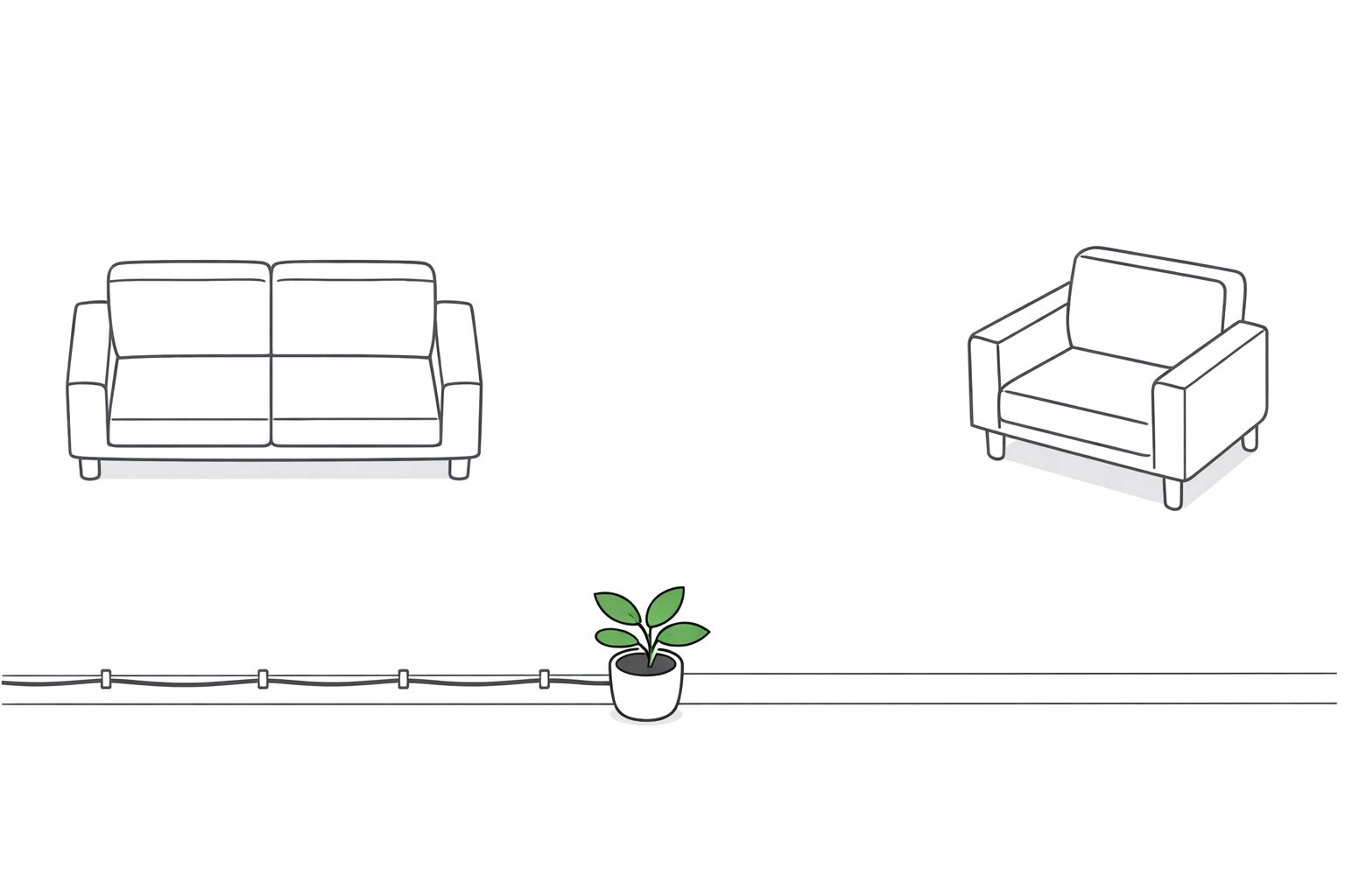 Top-down view of a clear living room walkway with secured cords to prevent trips.