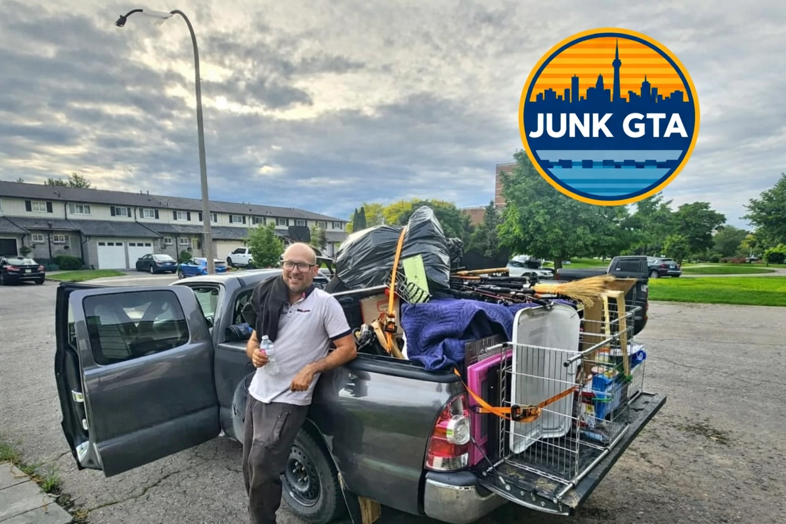 Roman, owner of Junk GTA, standing by his 2014 Toyota Tacoma