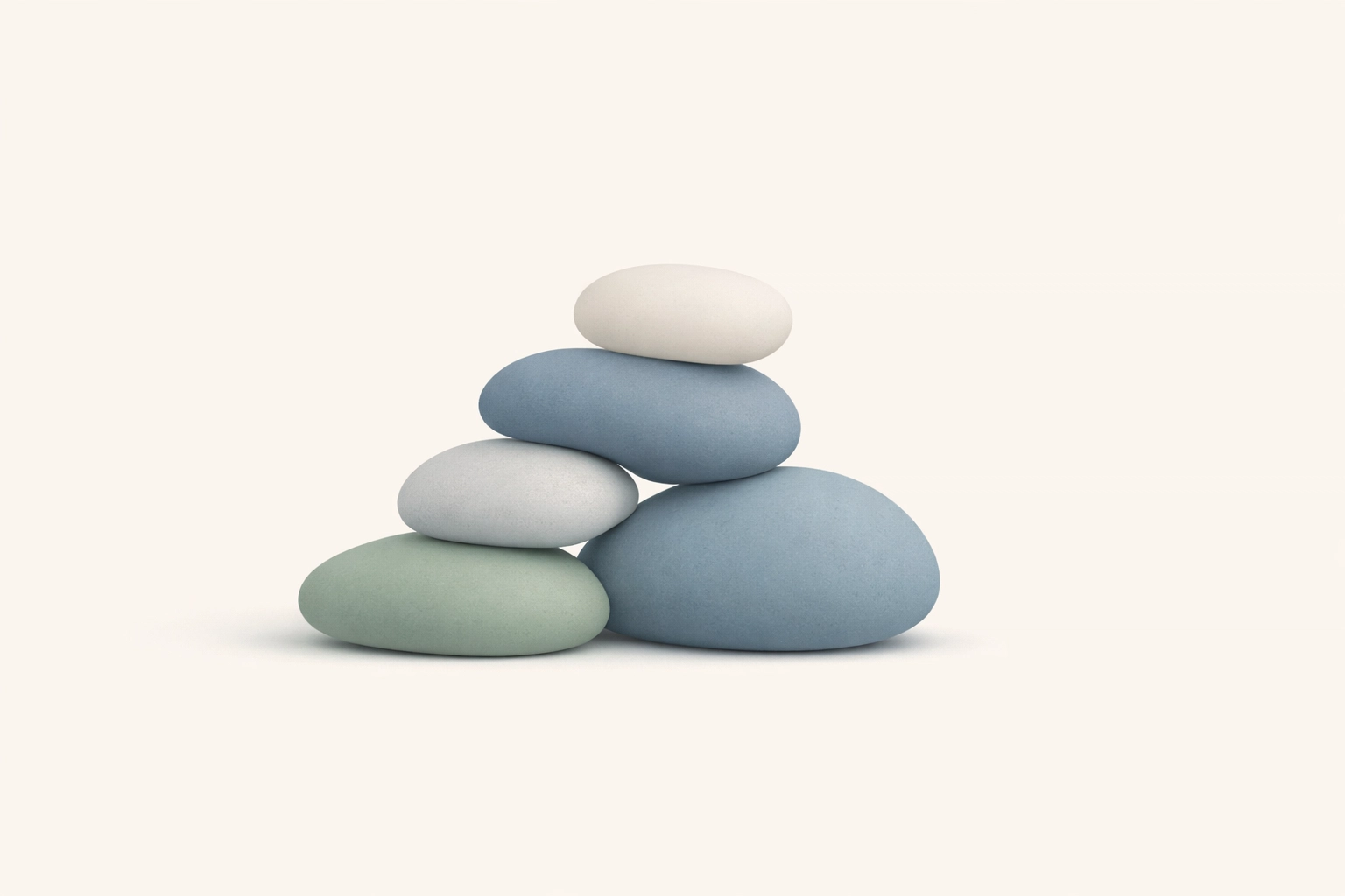 Stacked stones representing community care as a solution to individual therapist burnout.