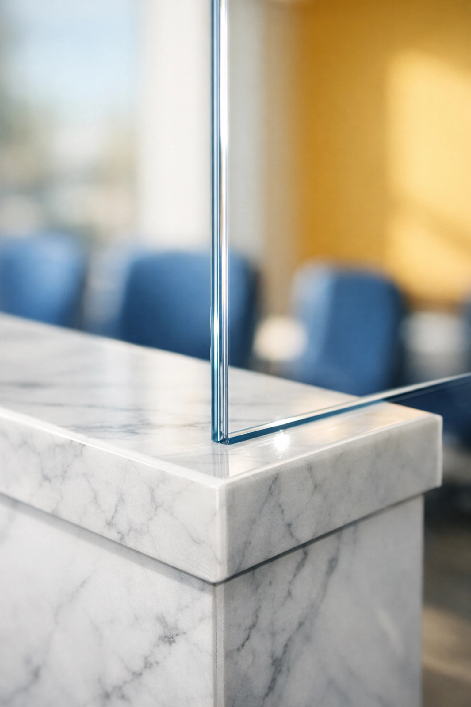 Sanitized marble reception desk and spotless glass partition in a North Attleboro office.