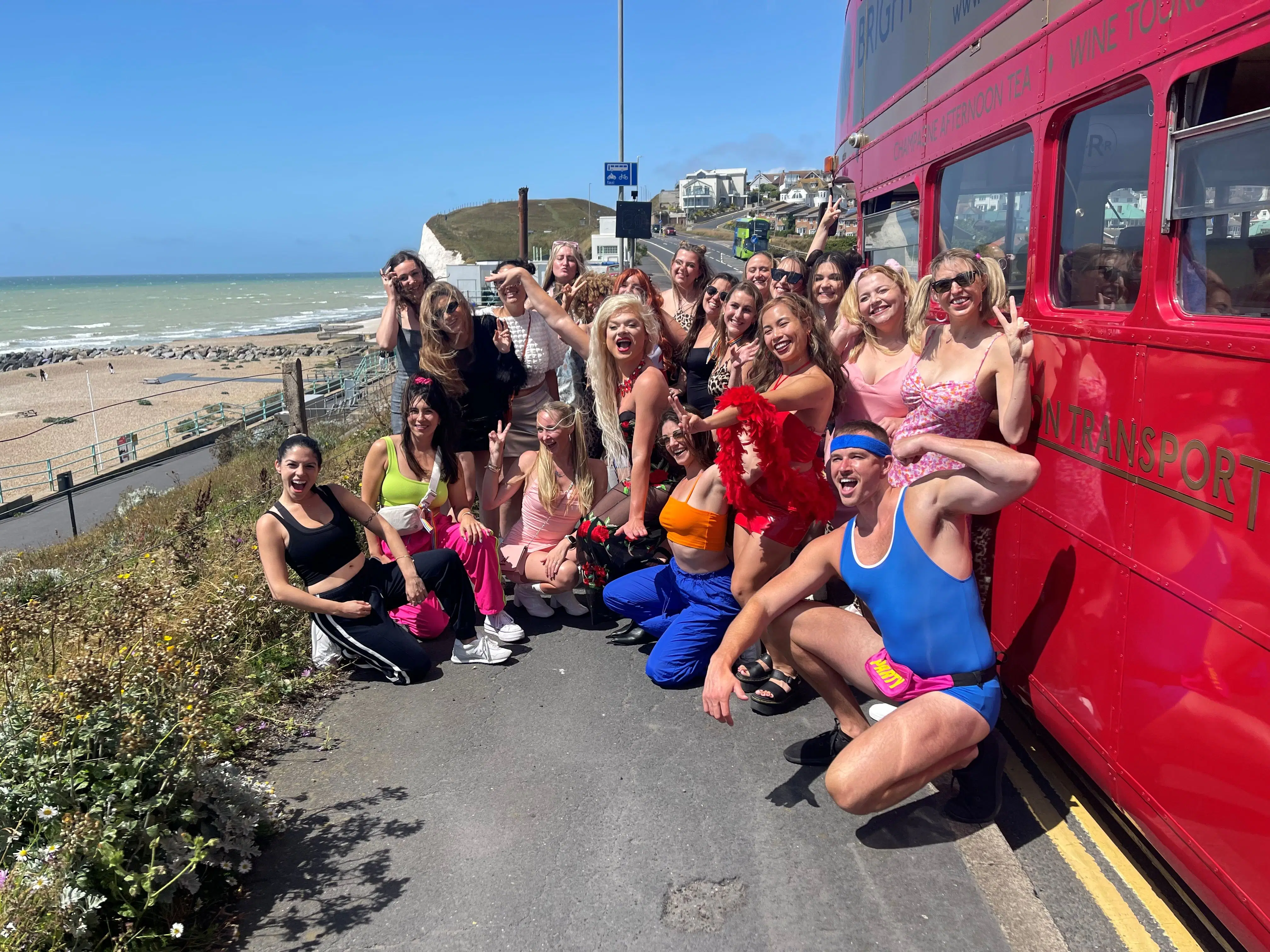 Hens dancing on a fabulous closed top bus with prosecco, the ultimate Brighton hen party experience.