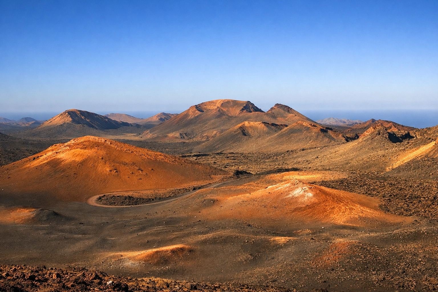 The volcanic landscape of Timanfaya National Park, a top destination for Lanzarote travel.