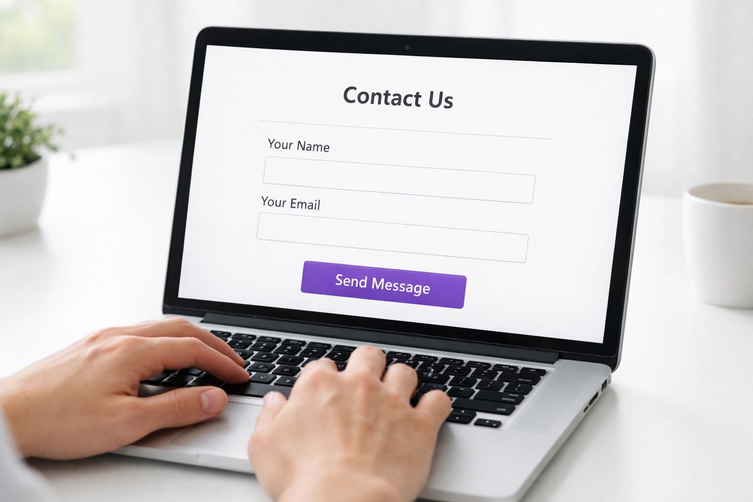 Simplified website contact form with name and email fields on laptop