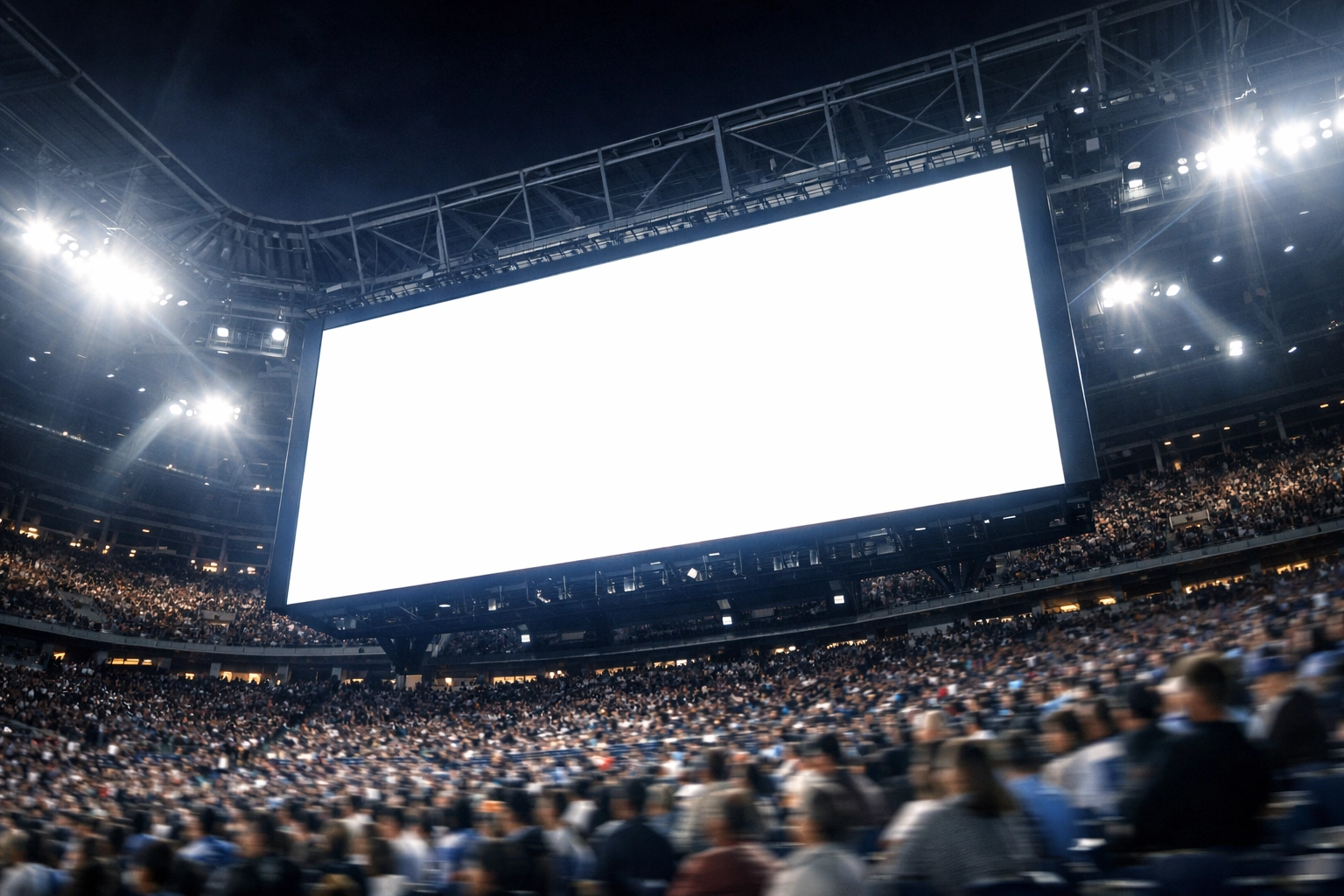 A bright stadium jumbotron showcasing personalized content for thousands of fans during a night game.