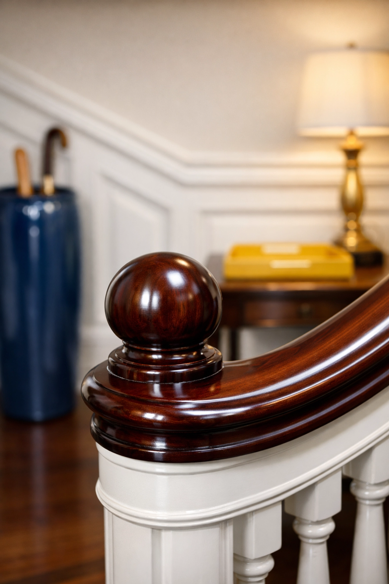 Polished mahogany banister in a historic West Cambridge home cleaned by a professional maid service.