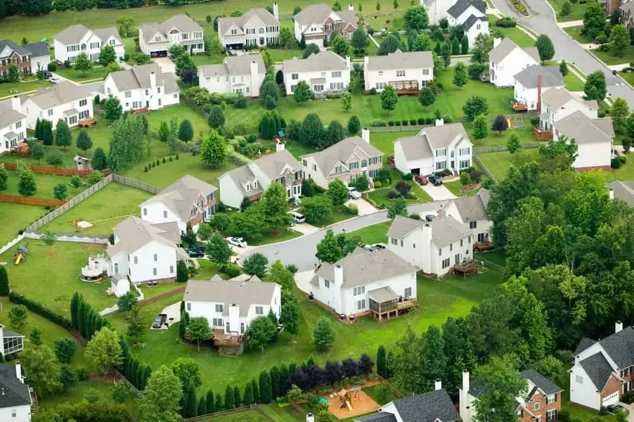 Aerial view of a suburban Charlotte or Waxhaw neighborhood featuring spacious single-family homes and tree-lined streets