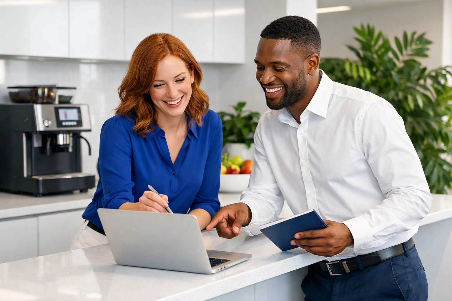 Staff collaborating in a clean office kitchen, showing the link between workplace hygiene and employee wellbeing.