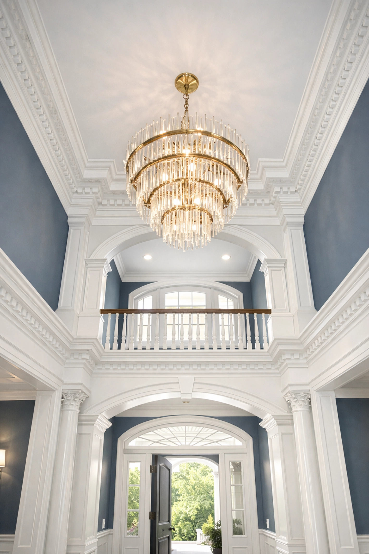 Grand Shrewsbury entryway with high ceilings and a clean chandelier from a professional house cleaning service.
