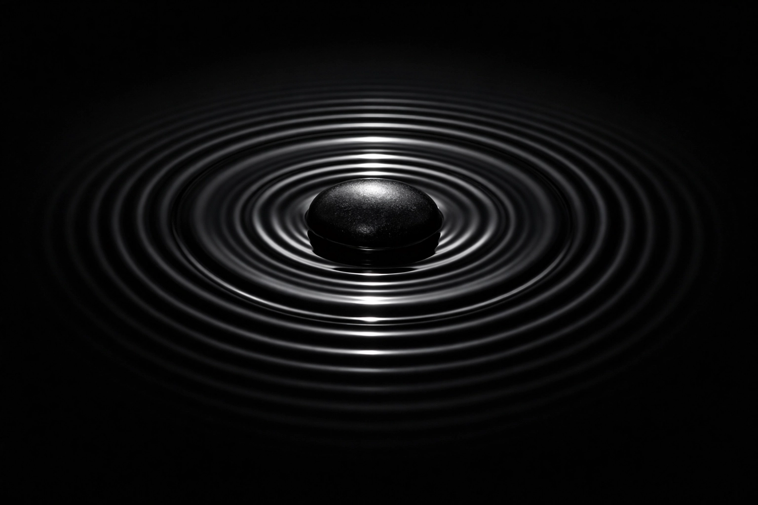 Concentric water ripples from a single stone, illustrating the wide-reaching impact of peaceful restraint and healing.