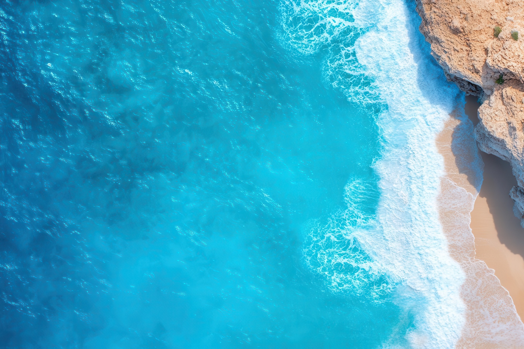 Scenic tropical coastline aerial view at golden hour - inviting island lifestyle and year-round demand