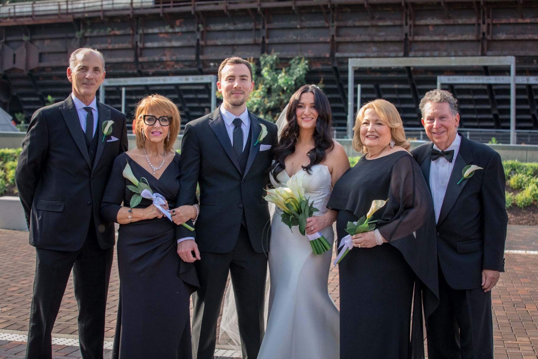 A family portrait outdoors—everyone together in one frame, one season of life