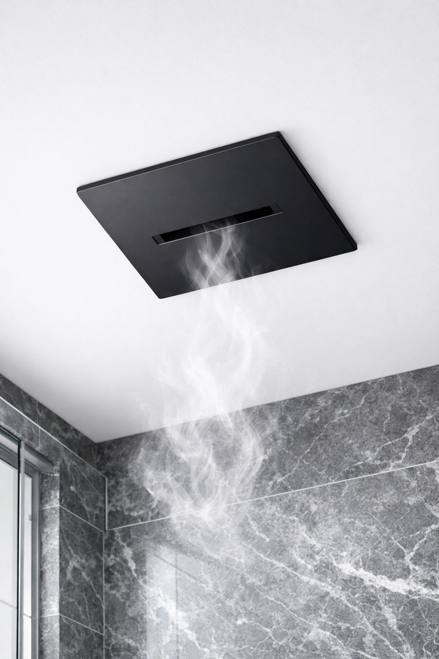 Sleek black bathroom exhaust fan ventilating steam to prevent mold in a remodeled shower.