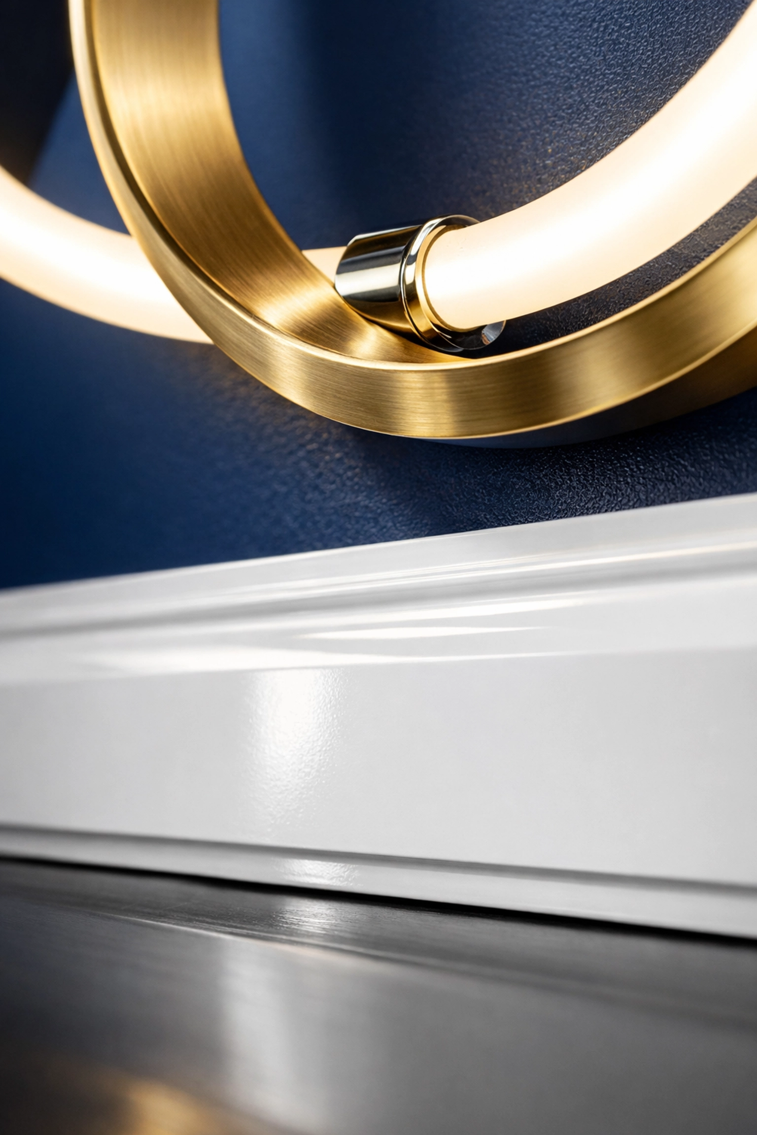 Close-up of a dust-free modern light fixture and baseboard maintained by professional cleaning services in Natick.