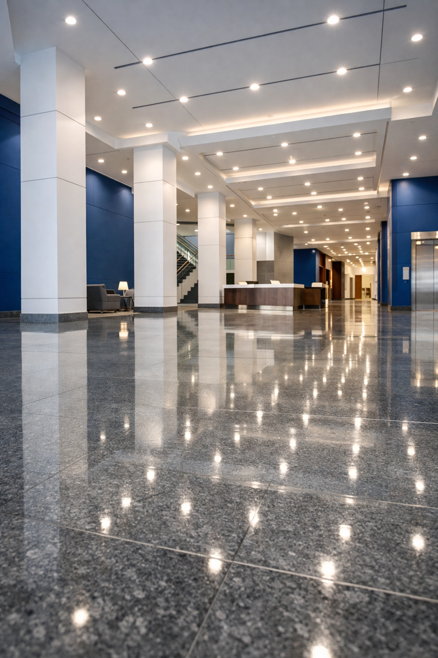 Grand Boston office lobby with polished stone floors after professional post-construction cleaning MA.