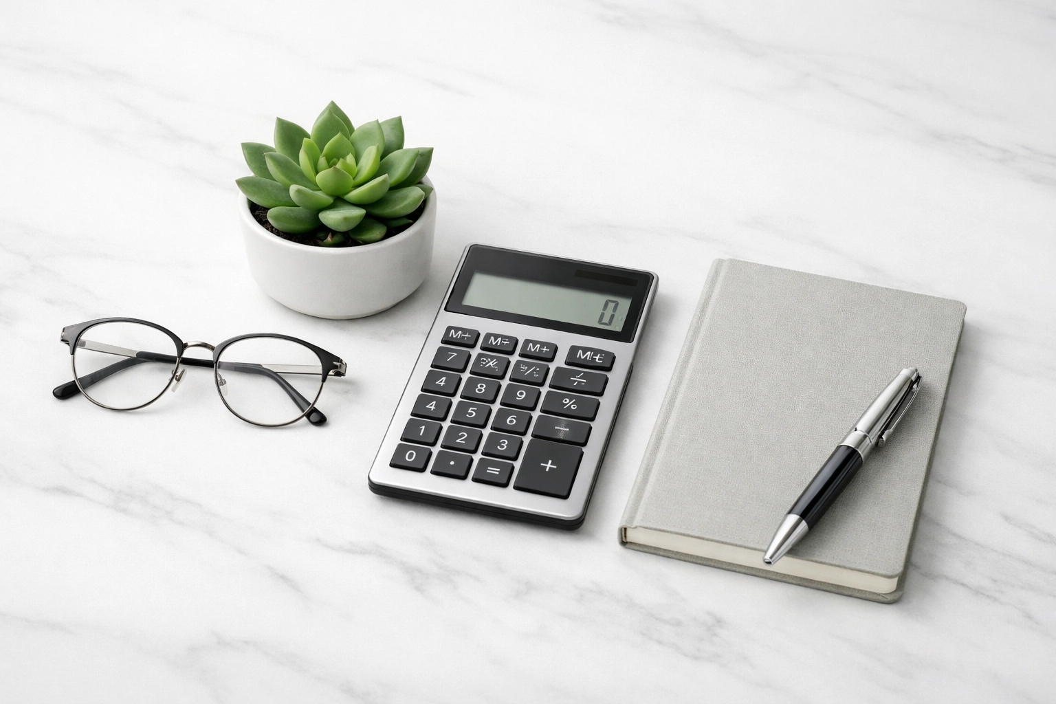 Calculator and notebook on a desk for comparing a cash advance vs an installment loan in Canada.