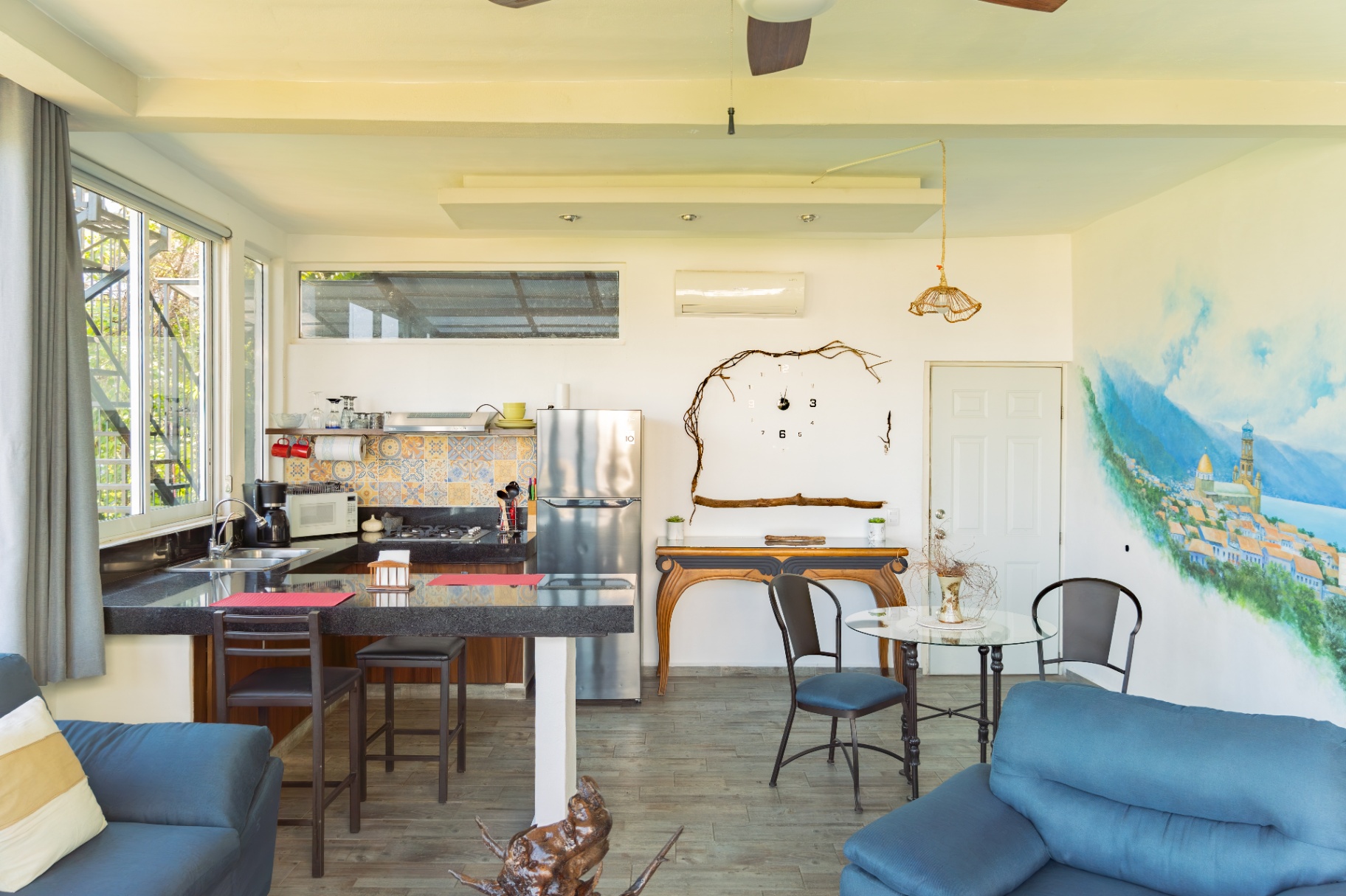 Bright condo interior with open kitchen