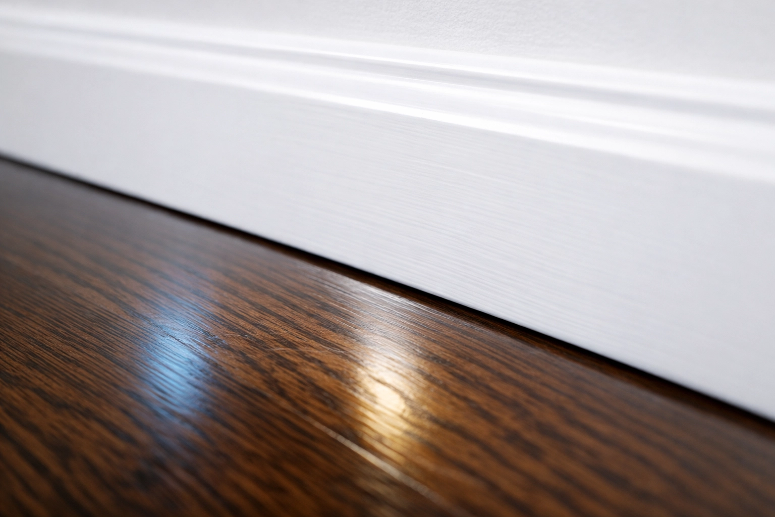 Close-up of clean baseboards and polished floors after post construction cleaning in a Holliston home.