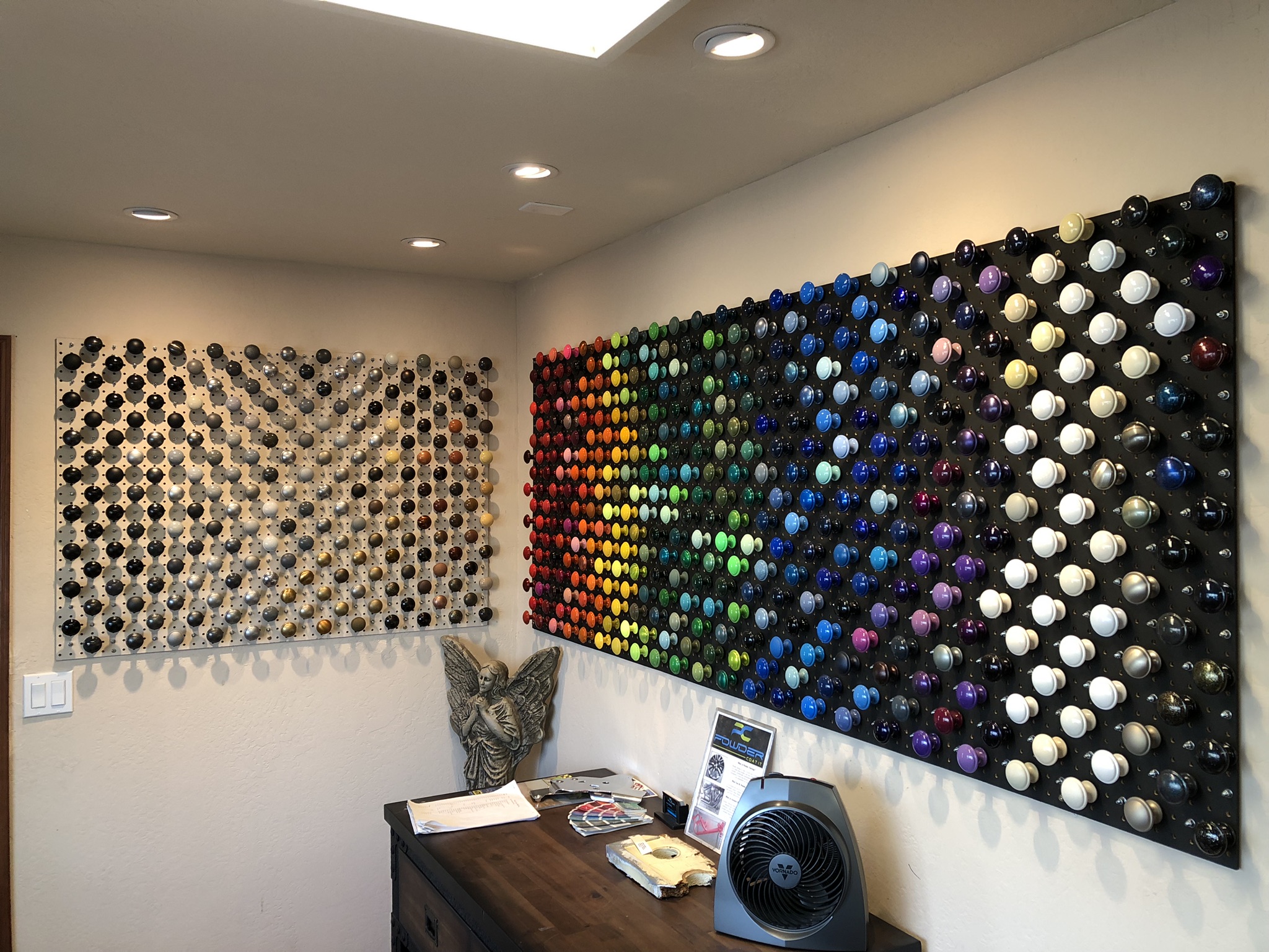 Powder coat color sample wall showing a wide range of custom finishes