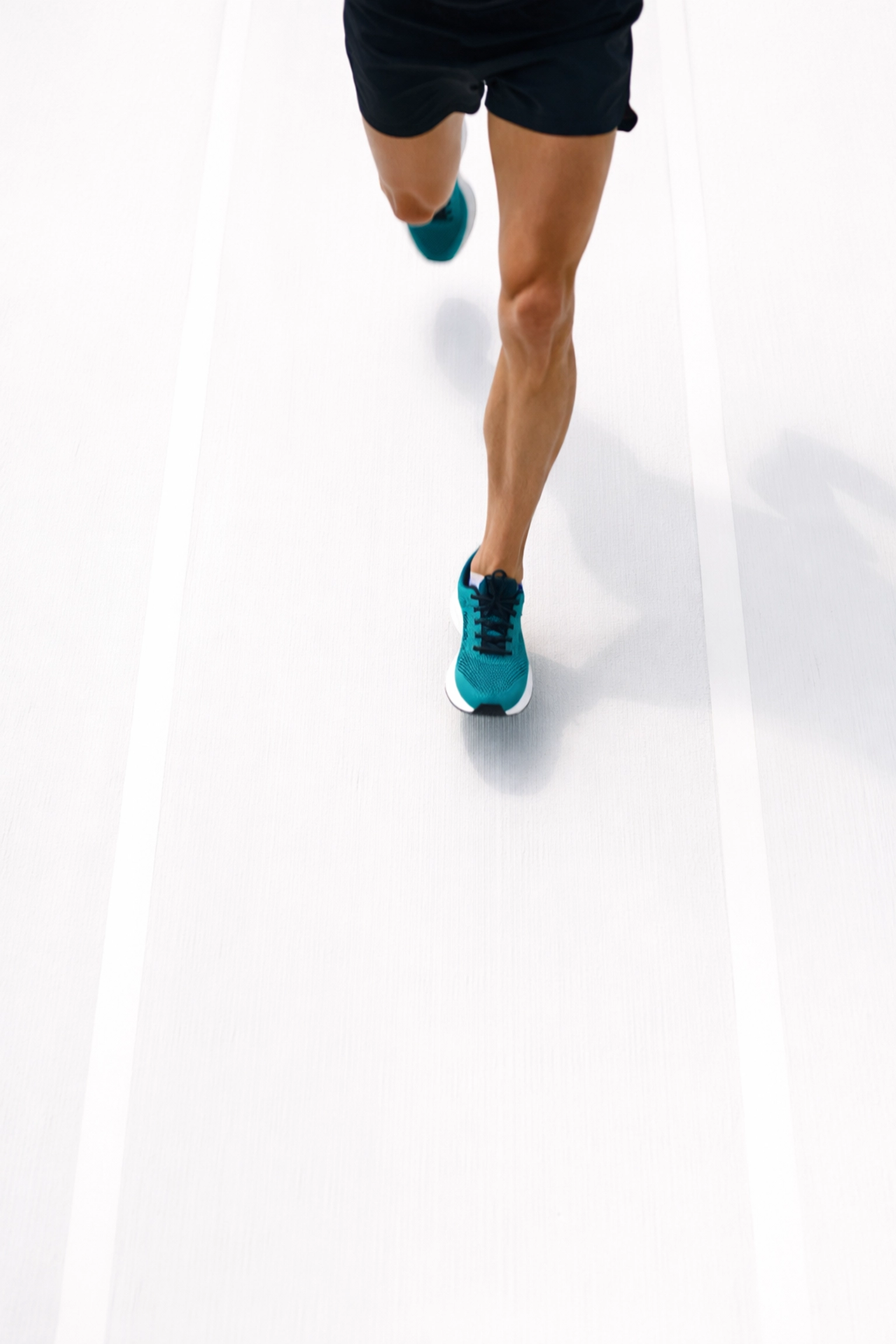 Overhead view of a runner in motion, highlighting stride length and foot placement for proper running form