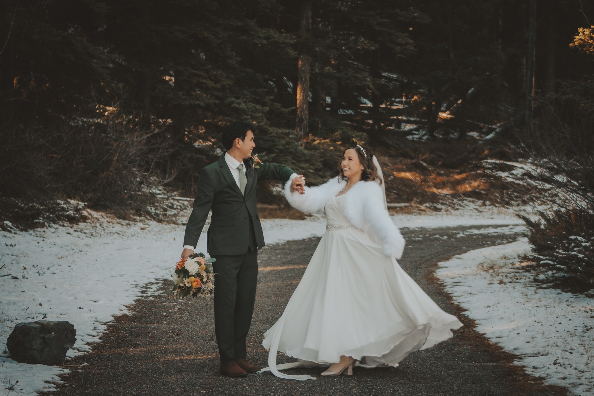Couple eloping in winter attire in the Canadian Rockies