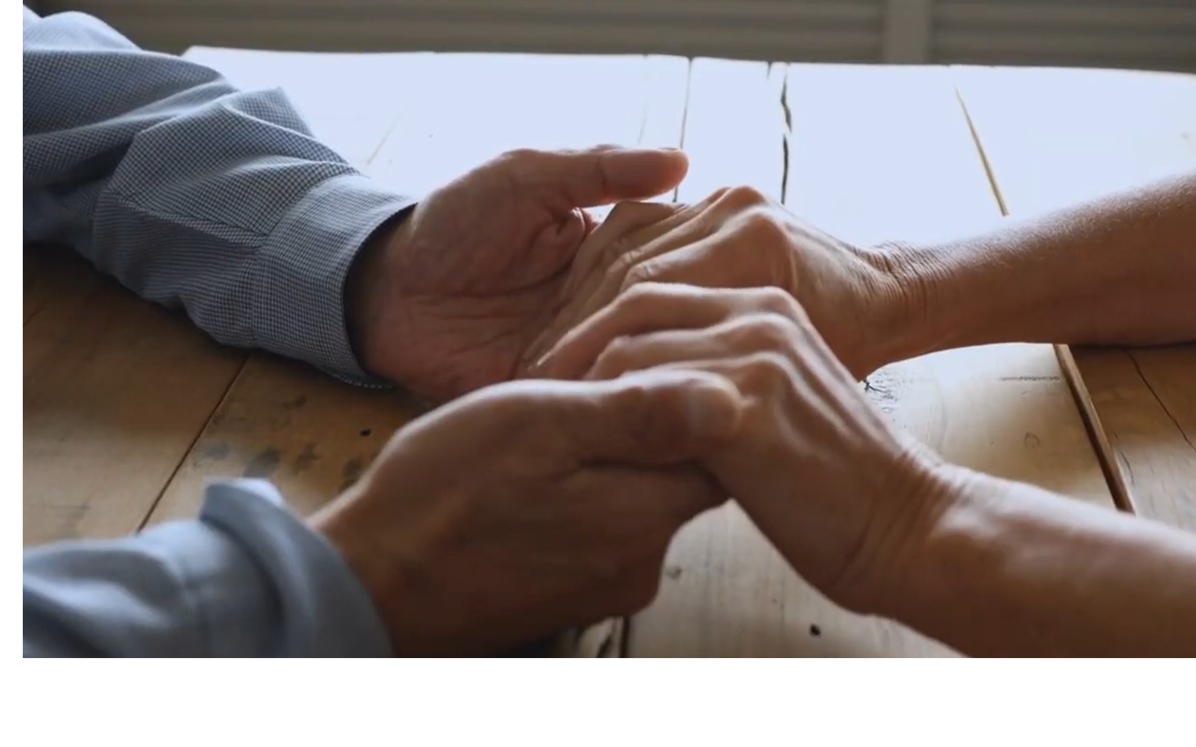 Two people in conversation at a table