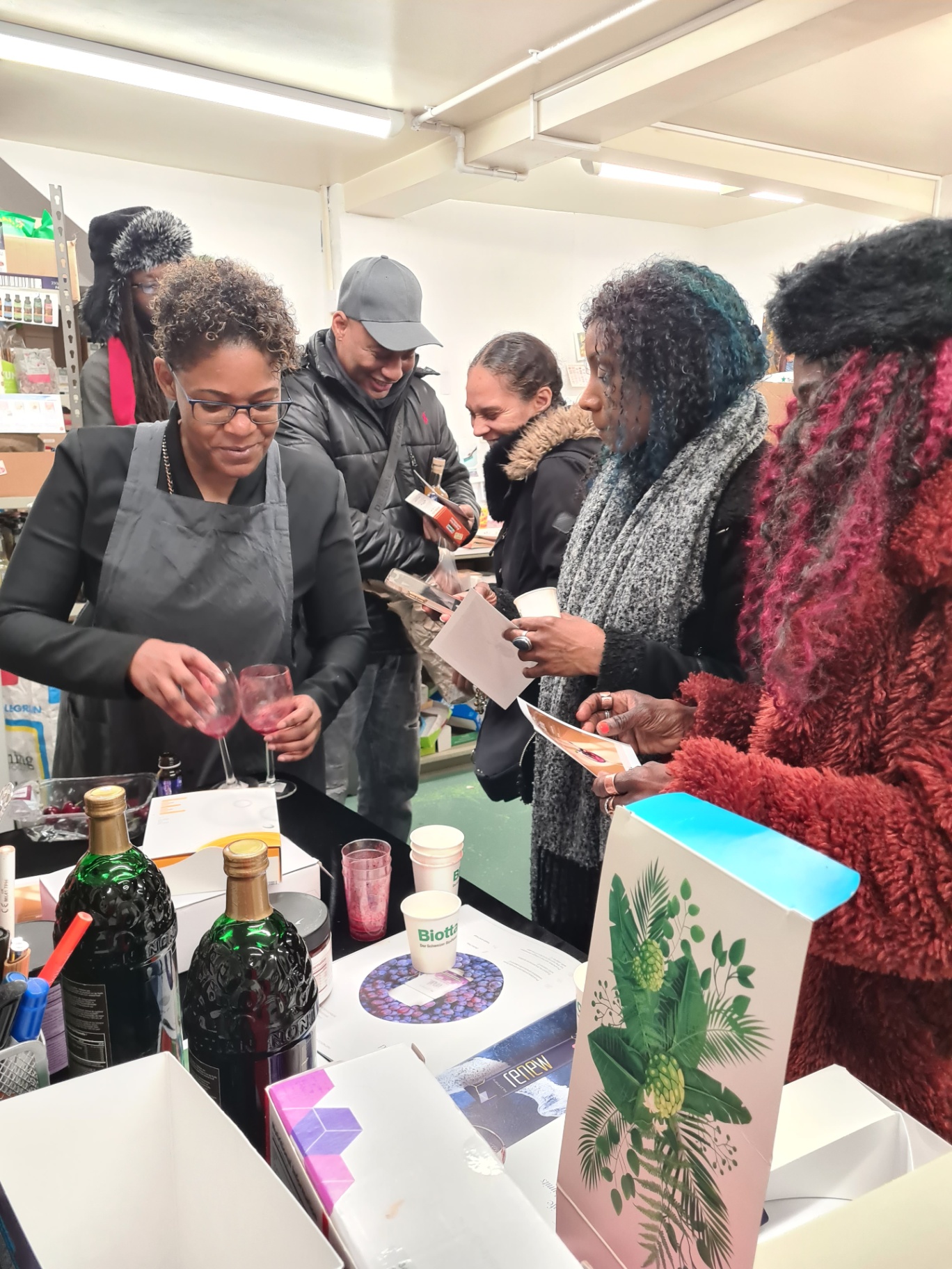 Close-up of wellness elixirs being poured and served during the Wise Woman’s Cabinet tasting