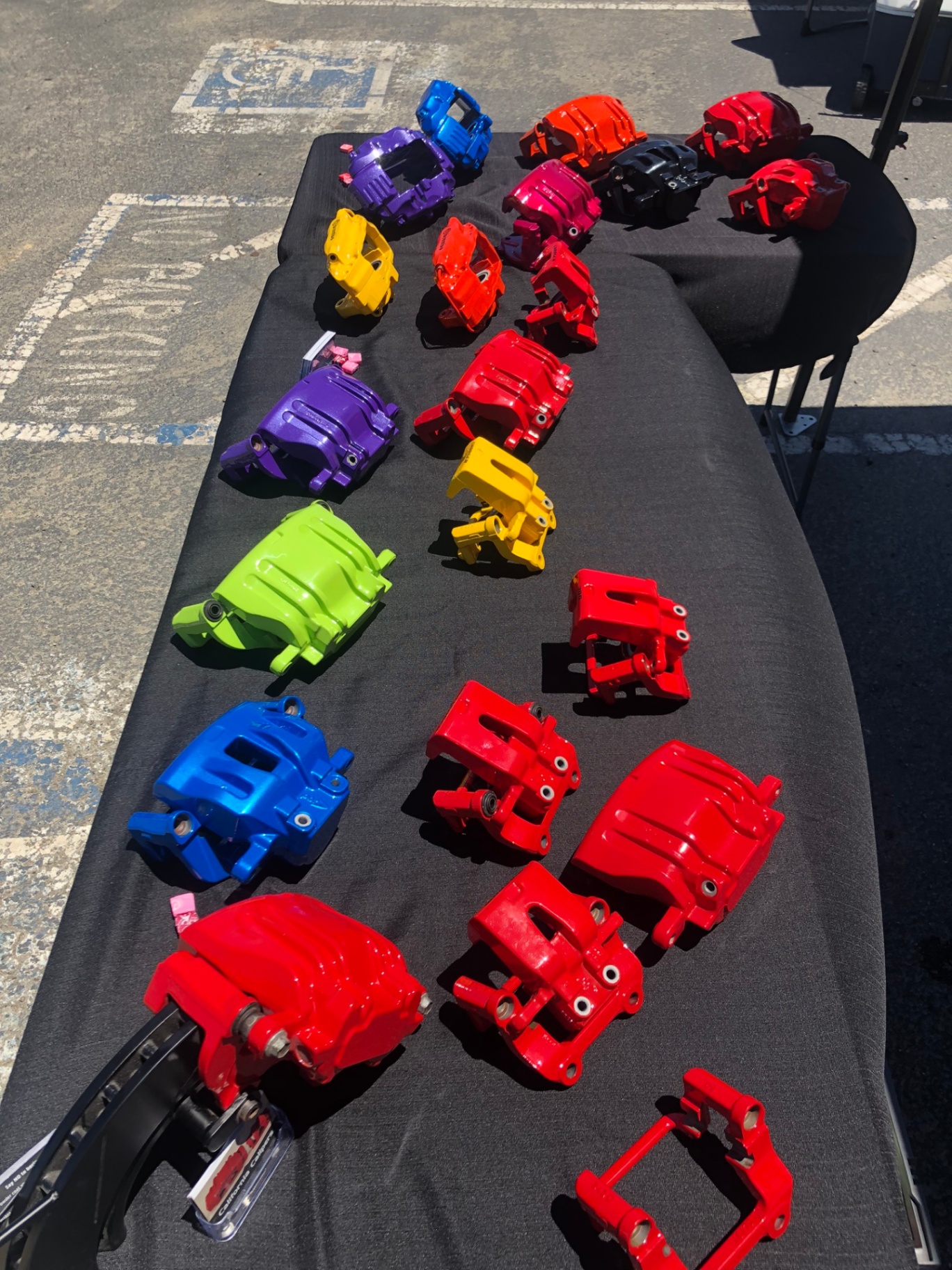 California Calipers display table showing a variety of powder-coated brake caliper colors and finishes.