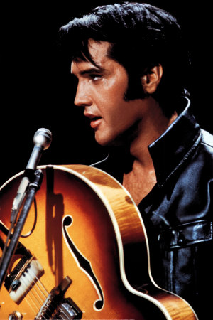 Elvis Presley performing in his iconic black leather outfit during the '68 Comeback Special