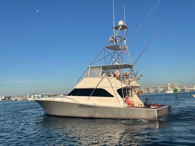 Full side view of the sportfishing boat Triton